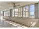 Bright sunroom with hardwood floors and water views at 5130 Brittany S Dr # 408, St Petersburg, FL 33715