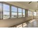 Sunroom with wall-to-wall windows offering scenic water views at 5130 Brittany S Dr # 408, St Petersburg, FL 33715