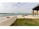 Scenic waterfront walkway with fire pit and seating at 5130 Brittany S Dr # 408, St Petersburg, FL 33715