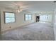 Spacious living room with large windows and ceiling fans at 11200 102Nd Ave # 51, Seminole, FL 33778
