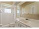 Bright bathroom with a combination tub and shower, vanity sink, and a window for natural light at 1442 Normandy Park Dr # 1, Clearwater, FL 33756