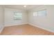 Bright bedroom with natural light from two windows, perfect for relaxation and rest at 1442 Normandy Park Dr # 1, Clearwater, FL 33756