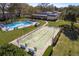 A view of the community amenities, including the pool and shuffleboard courts at 1442 Normandy Park Dr # 1, Clearwater, FL 33756
