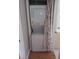Efficient laundry area featuring a stacked washer and dryer unit behind a privacy curtain at 1442 Normandy Park Dr # 1, Clearwater, FL 33756