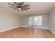 An airy living room is enhanced by a ceiling fan, which provides both comfort and visual appeal at 1442 Normandy Park Dr # 1, Clearwater, FL 33756