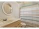 Clean bathroom with a striped shower curtain and vanity at 1442 Normandy Park Dr # 1, Clearwater, FL 33756