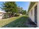 Private backyard with a grassy area and wooden fence at 1442 Normandy Park Dr # 1, Clearwater, FL 33756