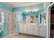 Bright bathroom with double vanity, tile floors, and a walk-in shower at 3503 10Th W Ln, Palmetto, FL 34221