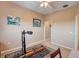 Bedroom featuring rowing machine, neutral walls, and doorway to walk-in closet at 3503 10Th W Ln, Palmetto, FL 34221