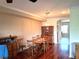 Spacious dining room with hardwood floors and a classic wooden dining set at 3503 10Th W Ln, Palmetto, FL 34221