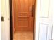 Interior view of a residential elevator with wood paneling and tile flooring at 3503 10Th W Ln, Palmetto, FL 34221