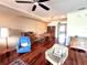 Inviting living area with hardwood floors, classic furnishings, and a dining set in the background at 3503 10Th W Ln, Palmetto, FL 34221