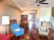Cozy living area with hardwood floors, comfortable seating, and a dining set in the background at 3503 10Th W Ln, Palmetto, FL 34221
