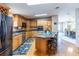 Bright kitchen, granite island, and stainless steel appliances at 18675 Us Highway 19 N # 377, Clearwater, FL 33764