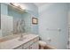 Clean bathroom with shower/tub combo, white vanity, and light blue walls at 3503 10Th W Ln, Palmetto, FL 34221