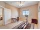Bedroom with window, ceiling fan, and exercise equipment at 3503 10Th W Ln, Palmetto, FL 34221