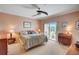 Spacious Primary bedroom with balcony access and ceiling fan at 3503 10Th W Ln, Palmetto, FL 34221