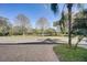 Landscaped view of pond with trees and walkway at 3503 10Th W Ln, Palmetto, FL 34221