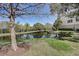 Peaceful pond scene with tree and building view at 3503 10Th W Ln, Palmetto, FL 34221