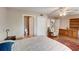 Comfortable bedroom with wood floors, built-in shelving, and en-suite bathroom at 3503 10Th W Ln, Palmetto, FL 34221