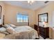 Bright bedroom with a comfortable bed, dresser, and window view at 3503 10Th W Ln, Palmetto, FL 34221