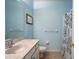 Clean bathroom with shower/tub combo, white vanity, and light blue walls at 3503 10Th W Ln, Palmetto, FL 34221