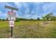 Dog park with signage indicating local rules and regulations at 4136 Rhone Dr, New Port Richey, FL 34655