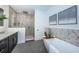 Luxurious bathroom with double vanity and soaking tub at 12305 3Rd E St # 1, Treasure Island, FL 33706