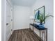 Elegant entryway with a console table, stylish artwork, and hardwood floors at 12305 3Rd E St # 1, Treasure Island, FL 33706