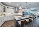 Modern kitchen with white cabinets, large island, and stainless steel appliances at 12305 3Rd E St # 1, Treasure Island, FL 33706