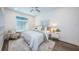 Cozy bedroom with a queen-size bed and light color scheme at 12305 3Rd E St # 1, Treasure Island, FL 33706