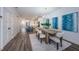 Open concept dining room, view of kitchen and hardwood floors at 12305 3Rd E St # 1, Treasure Island, FL 33706