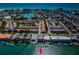 Aerial view of waterfront property, with boat slips and nearby beach at 12305 3Rd E St # 1, Treasure Island, FL 33706