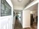 Bright entryway with tile flooring, and view to living area and kitchen at 6201 2Nd E St # 82, St Pete Beach, FL 33706