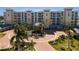 Luxury waterfront condos with circular driveway and tropical landscaping at 755 Collany Rd # 401, Tierra Verde, FL 33715