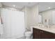 Clean bathroom with tub shower combo and dark vanity at 755 Collany Rd # 401, Tierra Verde, FL 33715