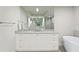 Elegant bathroom with a large vanity, soaking tub, and walk-in shower at 755 Collany Rd # 401, Tierra Verde, FL 33715