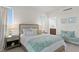 Peaceful bedroom with ensuite bathroom and sitting area at 755 Collany Rd # 401, Tierra Verde, FL 33715