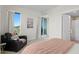 Bright bedroom with sliding glass doors to balcony at 755 Collany Rd # 401, Tierra Verde, FL 33715