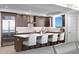 Modern kitchen with stainless steel appliances and large island with seating at 755 Collany Rd # 401, Tierra Verde, FL 33715