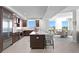Modern kitchen with stainless steel appliances and large island with seating at 755 Collany Rd # 401, Tierra Verde, FL 33715