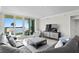 Spacious living room with water view, comfortable seating, and modern decor at 755 Collany Rd # 401, Tierra Verde, FL 33715