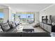 Spacious living room with water view, comfortable seating, and modern decor at 755 Collany Rd # 401, Tierra Verde, FL 33715