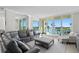 Spacious living room with water view, comfortable seating, and modern decor at 755 Collany Rd # 401, Tierra Verde, FL 33715