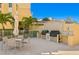 Community grills and seating area for outdoor entertaining at 755 Collany Rd # 401, Tierra Verde, FL 33715