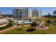 Resort-style pool with a fire pit and walking path nearby at 755 Collany Rd # 401, Tierra Verde, FL 33715