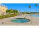 Inviting spa with comfortable seating and beautiful landscaping at 755 Collany Rd # 401, Tierra Verde, FL 33715