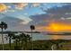 Breathtaking sunset view with palm trees and islands at 755 Collany Rd # 401, Tierra Verde, FL 33715