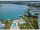 Beautiful aerial shot showcasing the pool and shuffleboard amenities of this waterfront condo community at 1868 Shore S Dr # 410, South Pasadena, FL 33707