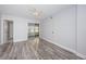 Bedroom with beautiful flooring and access to a screened in patio at 1868 Shore S Dr # 410, South Pasadena, FL 33707